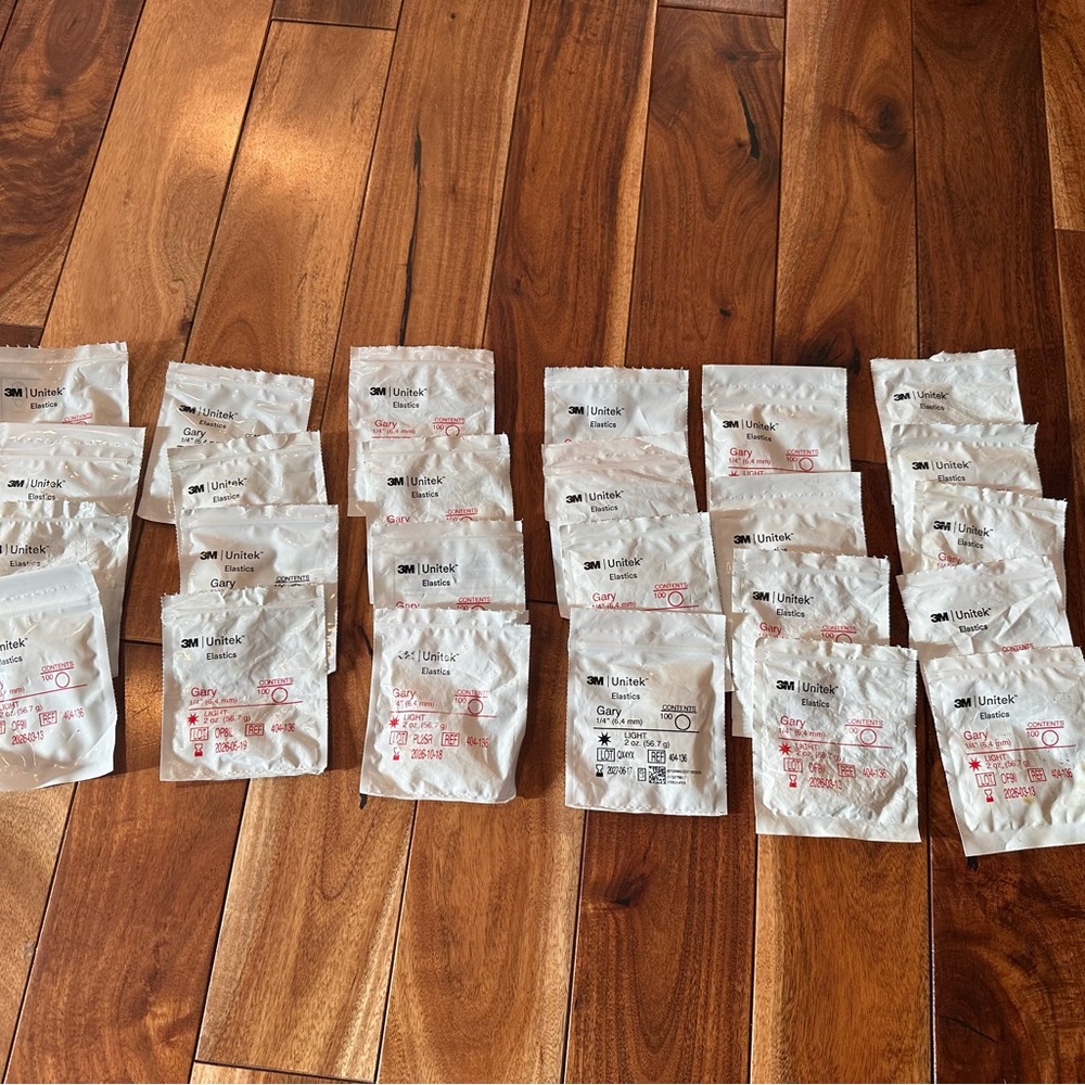 3M Unitek Dental Supplies Gary bands 24 bags.  Some brand new and some opened